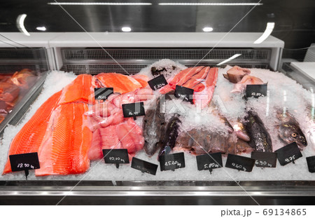 seafood in fish shop fridge display case 69134865