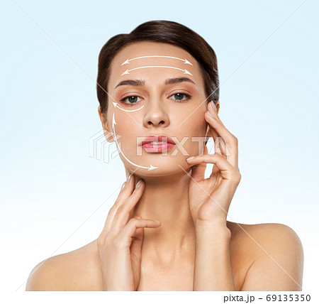 beautiful young woman face with massage lines beautiful young woman face with massage lines 69135350