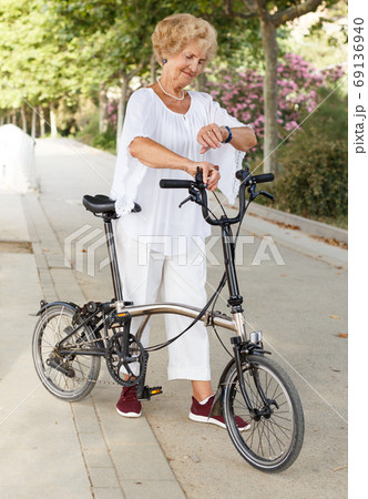 Elderly woman going to biking Elderly woman going to biking 69136940