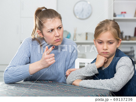 Mother lecturing her teenage daughter Mother lecturing her teenage daughter 69137236