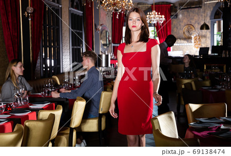 Woman in elegant red dress Woman in elegant red dress 69138474
