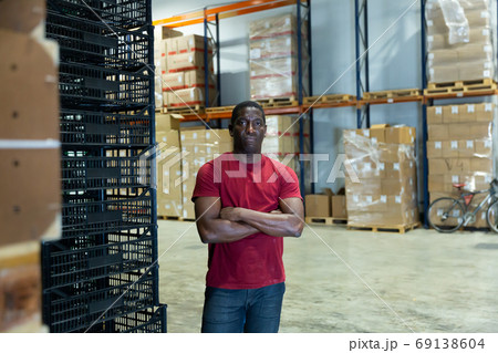 Portrait of afro man worker in warehouse 69138604