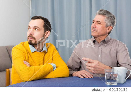 Mature father and son serious talk Mature father and son serious talk 69139152