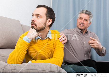 Adult father and son solve problems Adult father and son solve problems 69139688