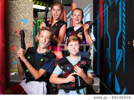 Teen kids with laser guns 69140418