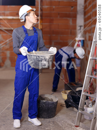 Builder in process of repair Builder in process of repair 69140588