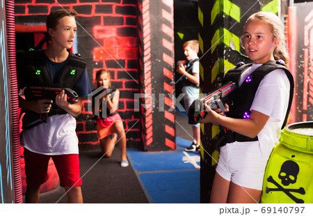 Teen kids during lasertag game 69140797