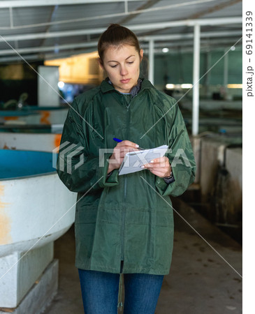 Female in fish breeding incubator Female in fish breeding incubator 69141339