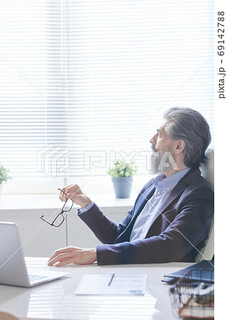 Stylish Office Worker Looking Away Stylish Office Worker Looking Away 69142788