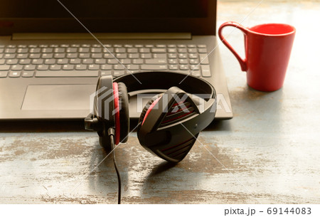 Headphone for Computer, Skype placed near laptop on window sunlight in morning. 69144083