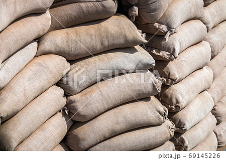 background made of sandbags to protect military and civilian objects background made of sandbags to protect military and civilian objects 69145226