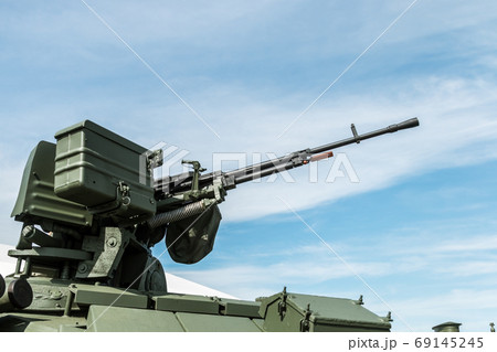 heavy machine gun mounted on the turret of a tank heavy machine gun mounted on the turret of a tank 69145245