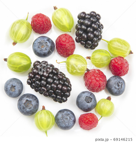 Assorted fresh different berries on a white plate. useful vitami Assorted fresh different berries on a white plate. useful vitami 69146215