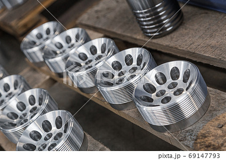 Billet obtained on lathe from steel. Many of same parts on pallets in industrial factory. Expect further processing. Metal industry products, workpieces. Steel products to automotive industry. Billet obtained on lathe from steel. Many of same parts on pallets in industrial factory. Expect further processing. Metal industry products, workpieces. Steel products to automotive industry. 69147793