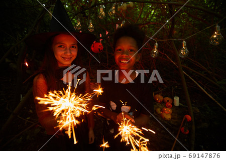 Kids with sparklers at party Kids with sparklers at party 69147876