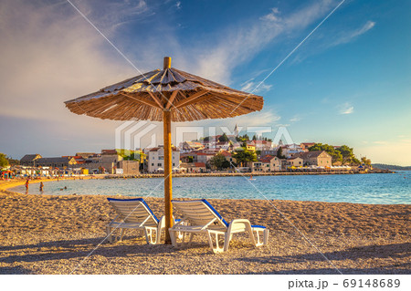 Beach at sunset near Primosten town. Beach at sunset near Primosten town. 69148689