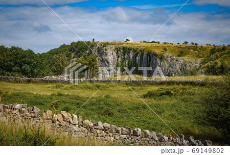 Cliffs of Cheddar Gorge from high viewpoint. High limestone cliffs in canyon in Mendip Hills in Somerset, England 69149802