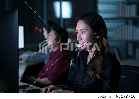 Young Thai Asian customer services care operators working night 69153716