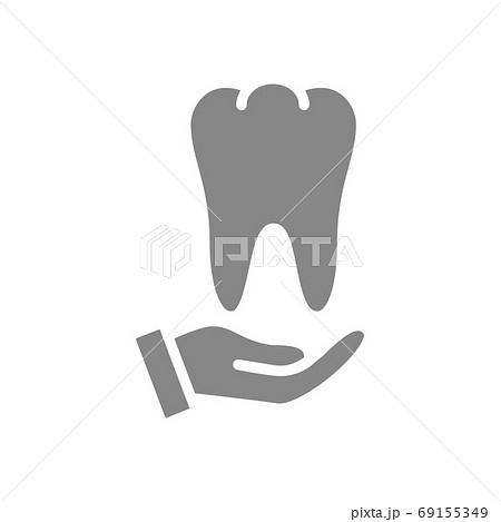 Human tooth on hand gray icon. Disease prevention symbol 69155349