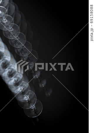 Two glasses of water on a glass table Two glasses of water on a glass table 69158088