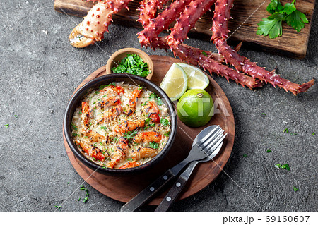 Chilean food. Baked crabmeat crab meat with cheese, cream and bread. Pastel o chupe de sentolla or king crab 69160607