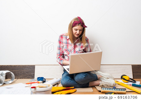 Beautiful girl using laptop computer at home 69163706