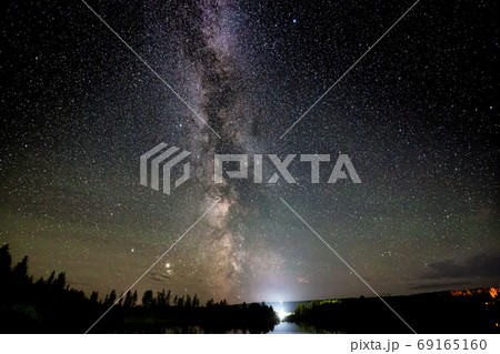 Milky Way and Stars Glowing during a Night Sky. Milky Way and Stars Glowing during a Night Sky. 69165160