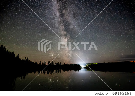 Milky Way and Stars Glowing during a Night Sky. Milky Way and Stars Glowing during a Night Sky. 69165163