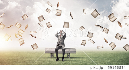 Young man in suit in park dont want to hear anything Young man in suit in park dont want to hear anything 69166854