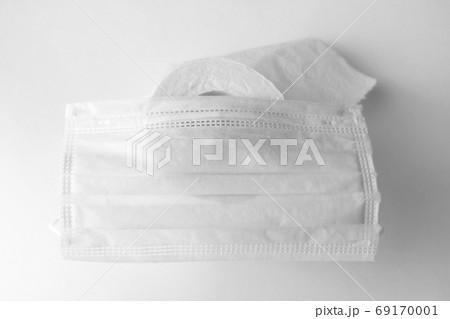 Toilet paper and medical mask. The panic of the coronavirus epidemic. 69170001