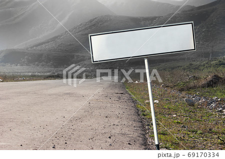 Empty blank road sign concept. The path extending into a gloomy distance Empty blank road sign concept. The path extending into a gloomy distance 69170334