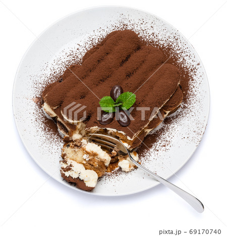 portion of Classic tiramisu dessert on ceramic plate isolated on white background with clipping path 69170740