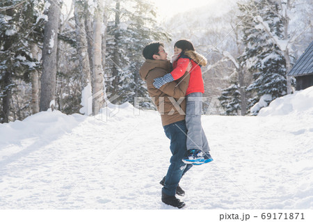 Asian father and son playing in the park on winter day Asian father and son playing in the park on winter day 69171871