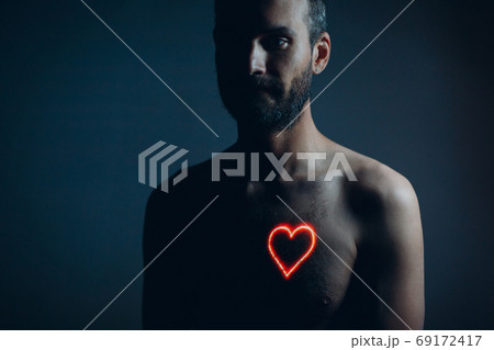 Adult man torso with heart shape on the chest. Healthy human heart. Adult man torso with heart shape on the chest. Healthy human heart. 69172417