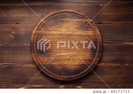 pizza cutting board or tray at wooden background texture 69172753