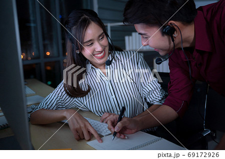 Young Thai Asian customer services care operators working night 69172926