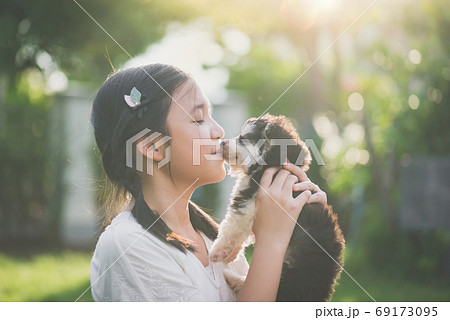 Beautiful asian girl playing with siberian husky 69173095