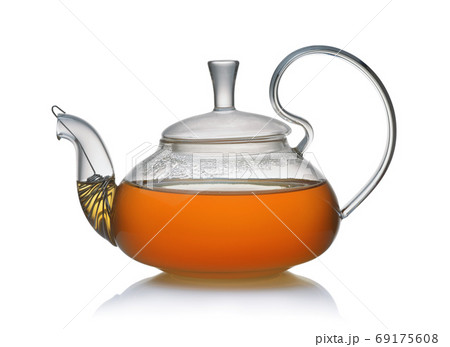 Side view of glass teapot full of fresh tea 69175608