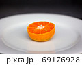 fresh sliced  oranges on the plate 69176928