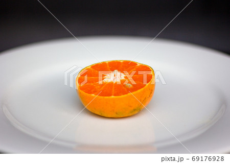 fresh sliced oranges on the plate fresh sliced oranges on the plate 69176928