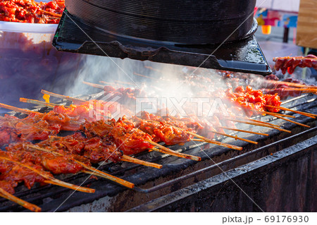 grilled chicken skewer sticks on the bbq grill outdoor 69176930