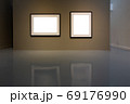 Blank photo frame on golden wall in art gallery. 69176990