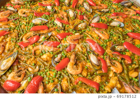 Seafood paella on a large frying pan, close up. Copy space Seafood paella on a large frying pan, close up. Copy space 69178512