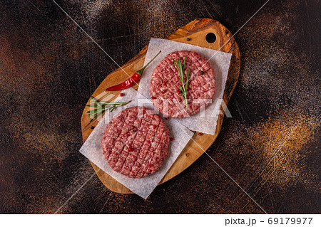 Fresh raw minced homemade grill beef burgers Fresh raw minced homemade grill beef burgers 69179977