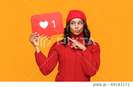 Ethnic woman sharing secret in social media. 69181171