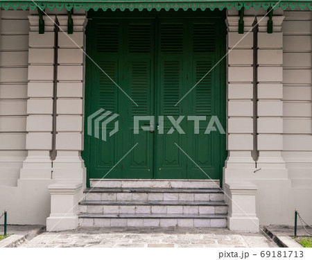 Green door with brick for background Green door with brick for background 69181713