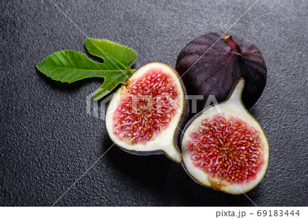Fresh ripe figs on a dark concrete background. Harvesting figs 69183444