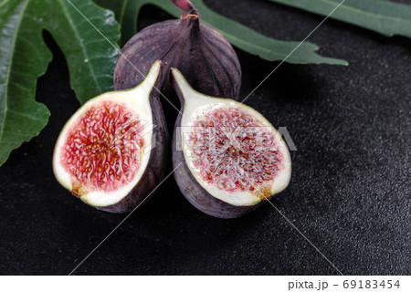 Fresh ripe figs on a dark concrete background. Harvesting figs 69183454