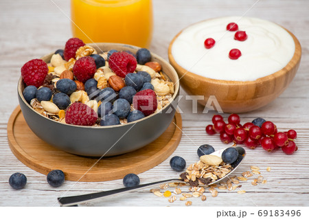 Bio Fruit Blueberry in bowl wood and Natural yogurt 69183496