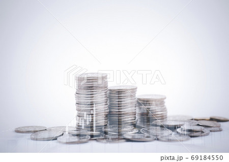 Double exposure of coins on the white background for finance and banking concept 69184550